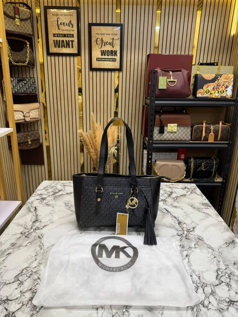 Micheal Kors Signature MK Tote Handbag With Tassel ChArrWa%d Dust Bag (Black)
