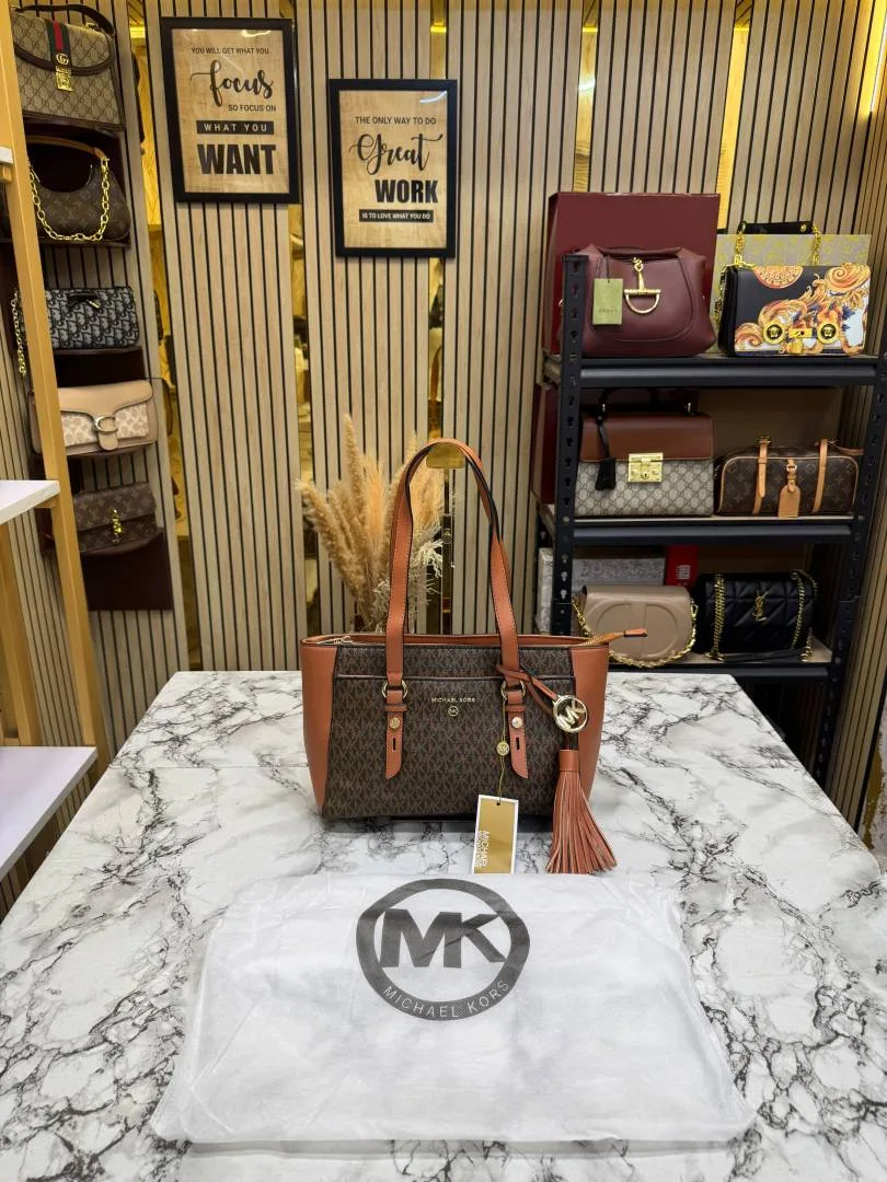 Micheal Kors Signature MK Tote Handbag With Tassel ChArrWa%d Dust Bag (Brown)