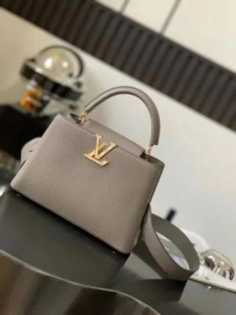 Loiuss_Vuitton_Capucines bag features a Taurillon leather body and signature gold-toned LV initials Bag With Box premium quality