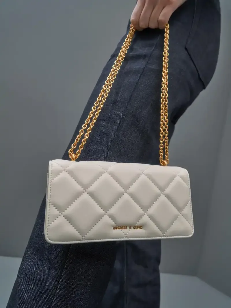 Charls & Keith, closely resembling the Arrietty Quilted Wallet On Chain or Paffuto Quilted Wallet On Chain