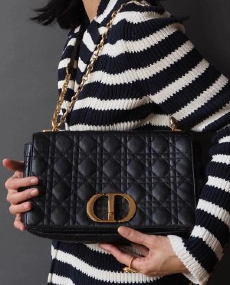 Diyor Caro bag featuring an antique gold-finish metal CD twist clasp bag with Box