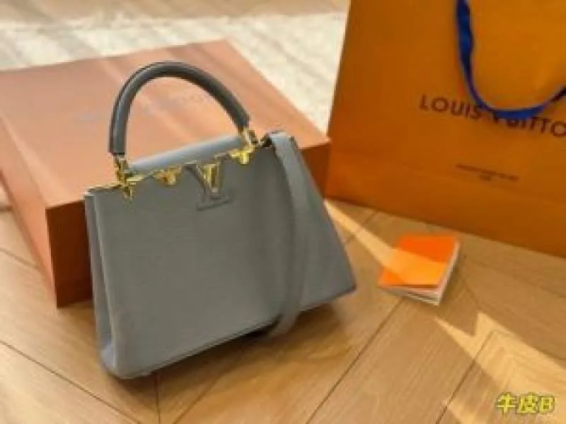 Loius Vutton Capucines BB handbag featuring unique gold-toned floral hardware along the top edge With Double Box